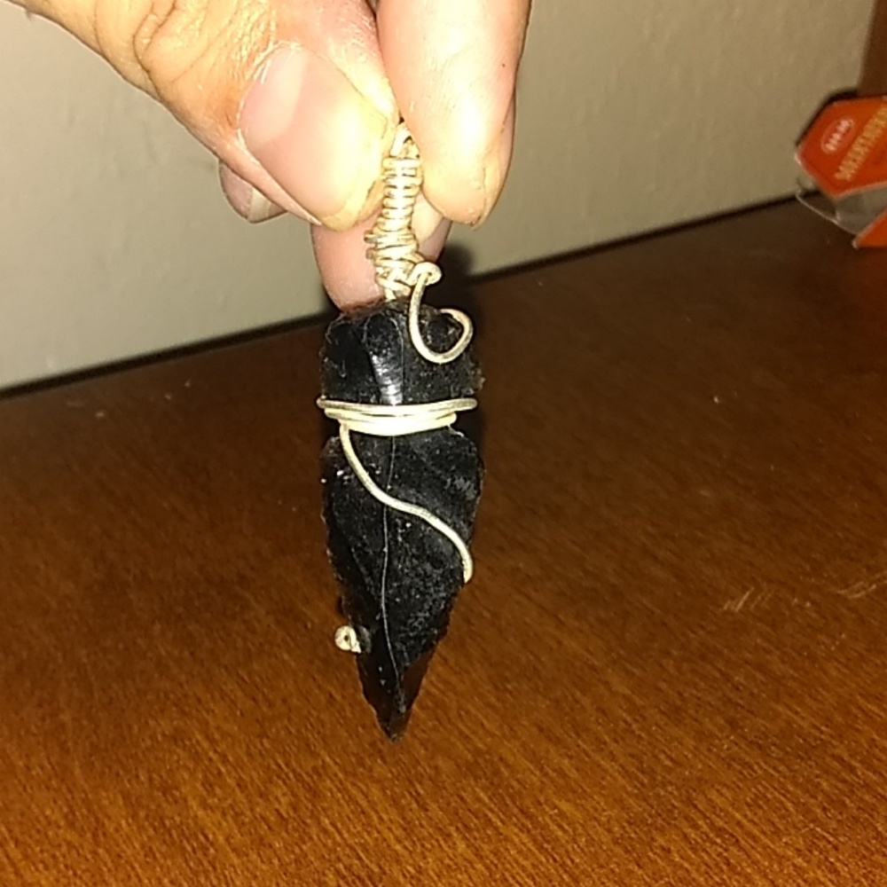 Obsidian wrapped in silver plated wire.